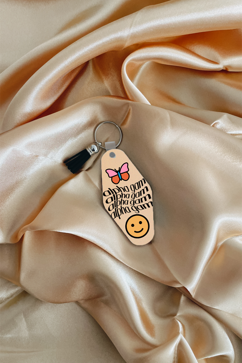 Smiley keychain - Alpha Gam - Spikes and Seams Greek
