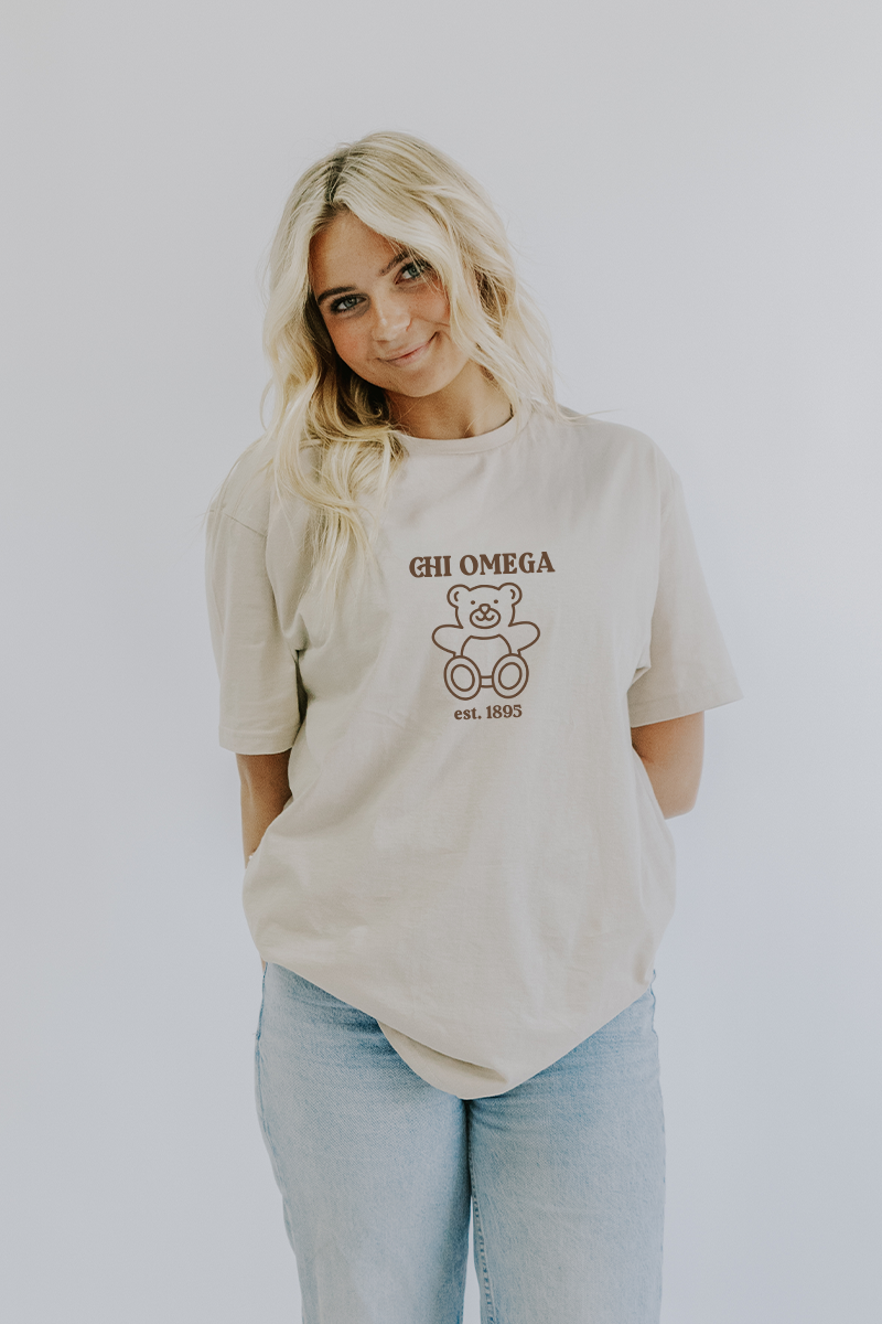 Spikes and Seams Greek Beige Teddy Bear Tee - Chi Omega Small